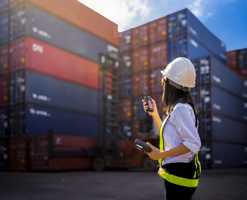 Woman Foreman control loading Containers box